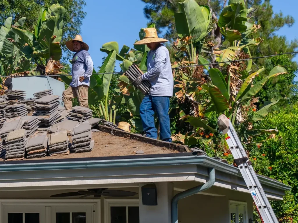 Preferred Roofing crew installing a tile roof in Orange County